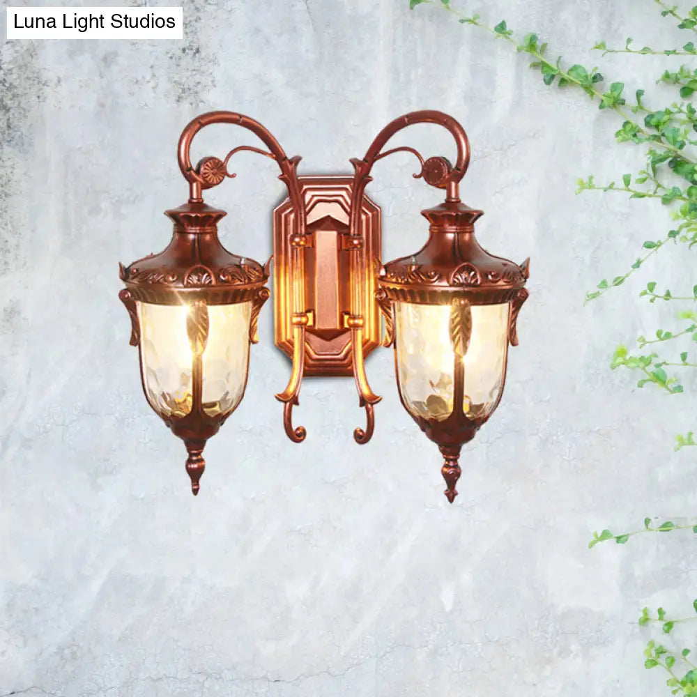 Countryside Black/Gold-Copper Urn Wall Sconce Light With Clear Glass - 2 Bulbs