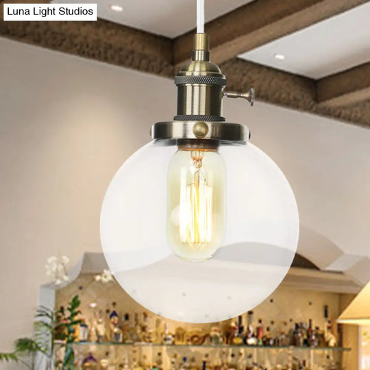 Farmhouse Orbit Pendant Light With Amber/Clear Glass And Adjustable Cord In 3 Elegant Finish