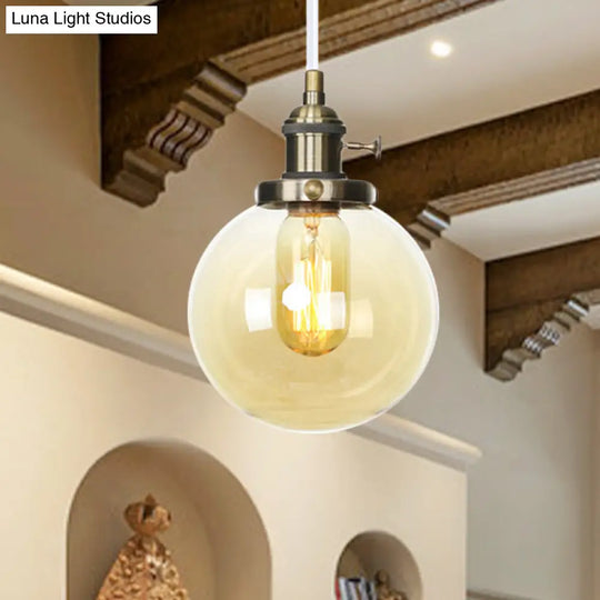 Farmhouse Orbit Pendant Light With Amber/Clear Glass And Adjustable Cord In 3 Elegant Finish