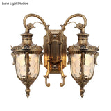 Farmhouse Style Wall Sconce With Dimpled Glass Shade And Scrolled Arms - Iron Black/Bronze 2 Lights