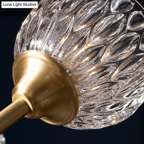 Gold Finish Chandelier With Metallic Branch Design And Clear Crystal Shade