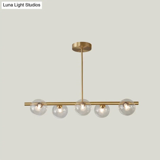 Linear Gold Pendant Light With Spherical Glass For Modern Minimalist Dining Table 5 / Clear