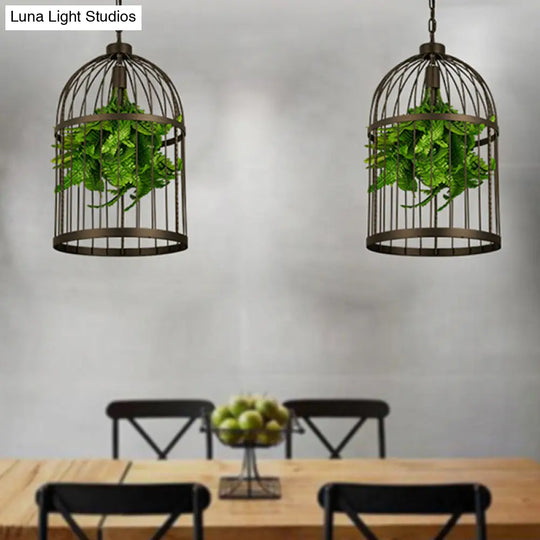 Industrial Black Iron Birdcage Pendant Lamp With Single Bulb And Artificial Plant Décor