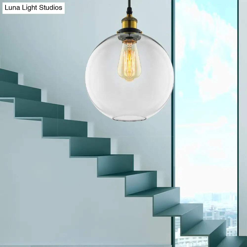 Industrial Globe Clear Glass Pendant Light With Antique Brass Finish - 1-Light Hanging Kit