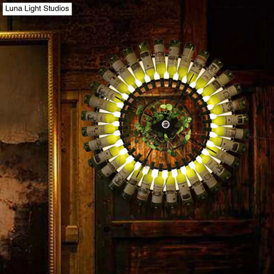 Industrial Led Wine Bottle Wall Sconce With Metal Fixture And Plant Accent In Black