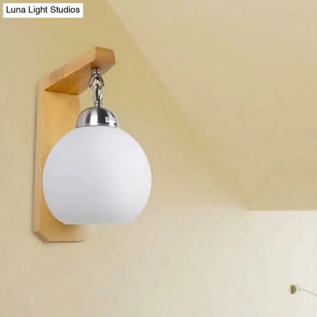 Industrial Wall Sconce With Opal Glass Globe Shade And Wood Backplate - Bedroom Lighting Fixture