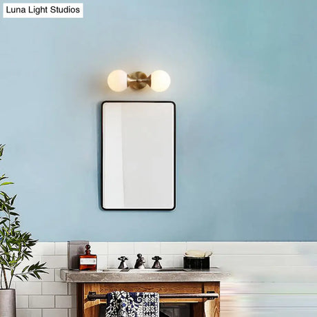 Ivory Glass Ball Wall Lamp With 2-Head Brass Sconce For Bedroom