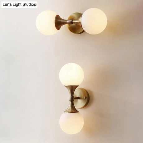 Ivory Glass Ball Wall Lamp With 2-Head Brass Sconce For Bedroom