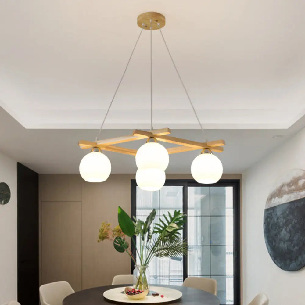 Japanese Style 4-Bulb Cream Glass Sphere Pendant Chandelier For Living Room In Wood