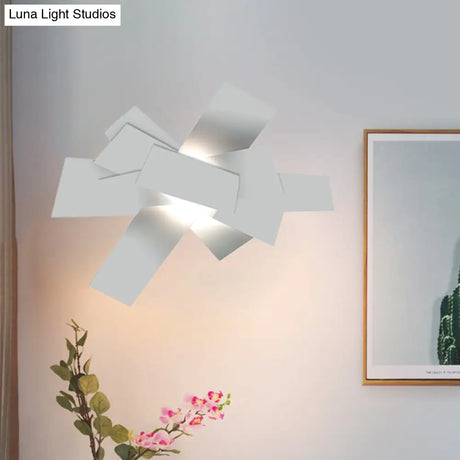 Metallic Nordic Wall Sconce With Stacked Surface And White Bulb Fixture