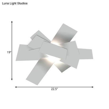 Metallic Nordic Wall Sconce With Stacked Surface And White Bulb Fixture