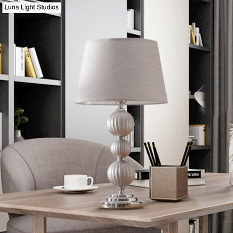 Minimal Silver Bedside Lamp With Ceramic Base And Fabric Shade