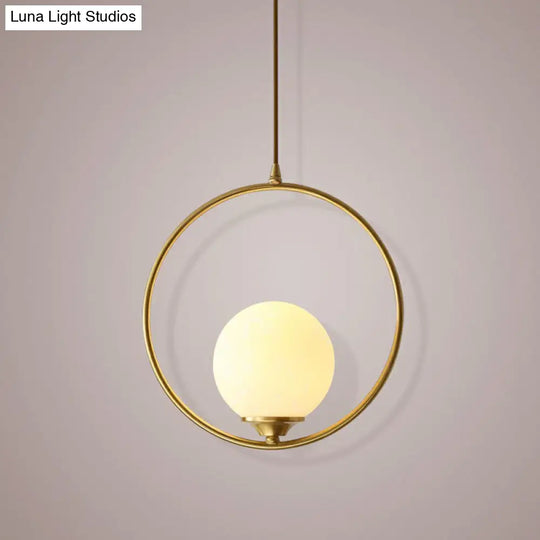 Minimalist Antique Gold Ball Ceiling Lamp With Cream Glass Shade And Ring Decoration