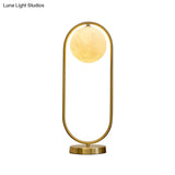 Minimalist Gold Metal Nightstand Lamp With Moon Glass Shade