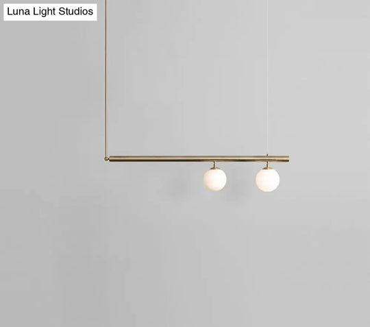 Minimalist Metal Pendant Lighting With Gold Accents - Modern Globe Glass Island Ceiling Light For