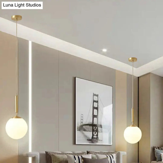 Milk Glass Ball Pendant Light With Brass Finish - Minimalist 1-Light Dining Room Fixture