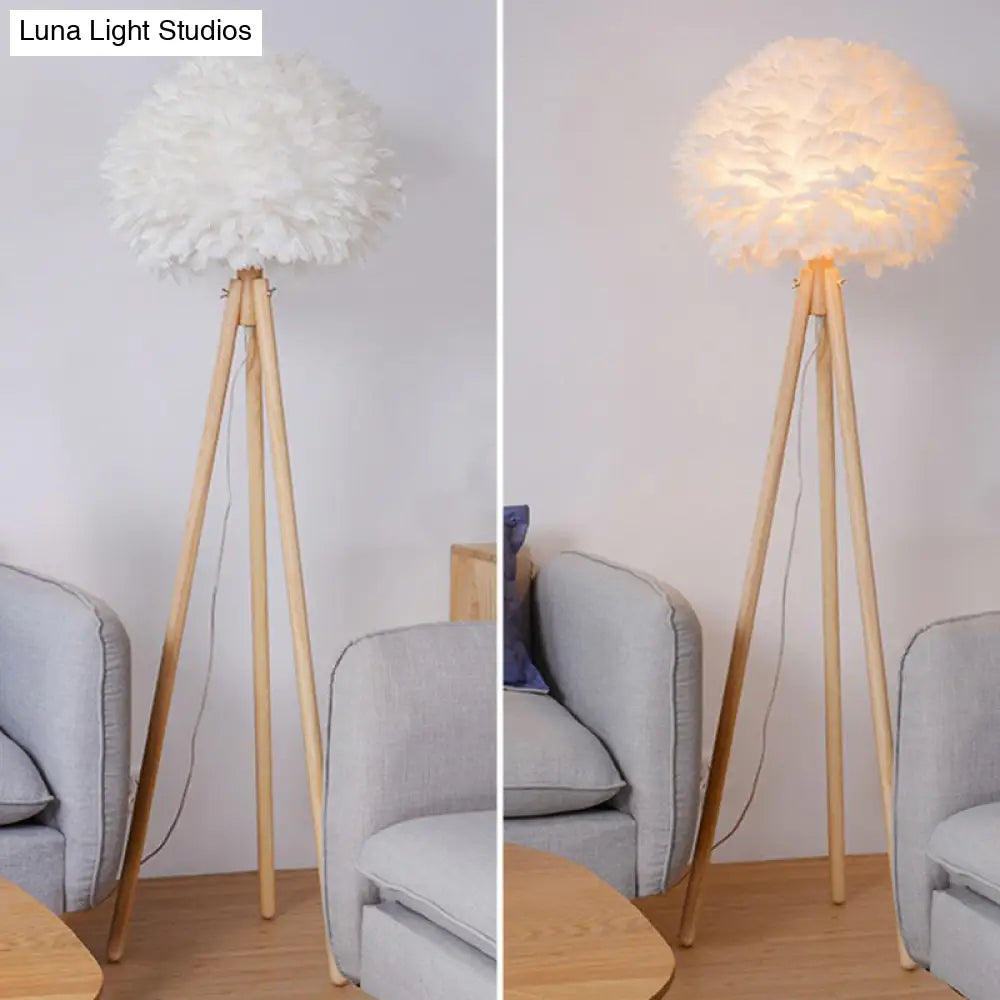 Minimalist White Dome Floor Lamp With Feather Detail And Wood Tripod Base