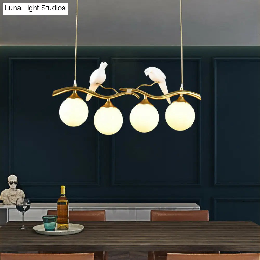 Modern Branch Island Pendant Light With Ball Glass Shade And Bird Deco - Metal 4-Light Fixture For