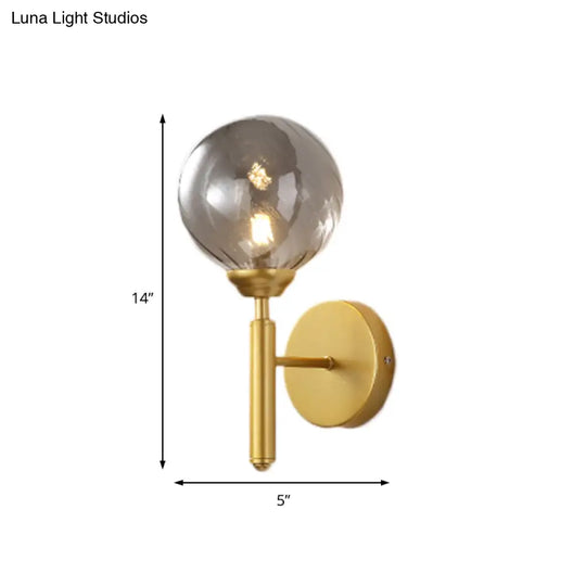 Modern Brass Wall Light With Smoked Textured Glass Globe Bulb