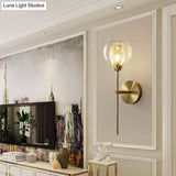 Modern Dual Cup Wall Sconce With Clear Glass And Metallic Finish In Black/Gold