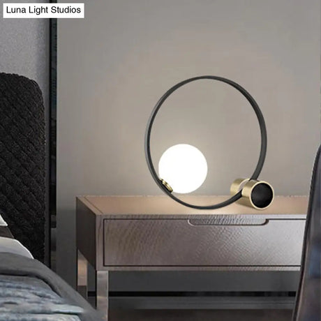Modern Metal Desk Lamp: Circle Bulb Nightstand Light In Black With Milk Glass Shade