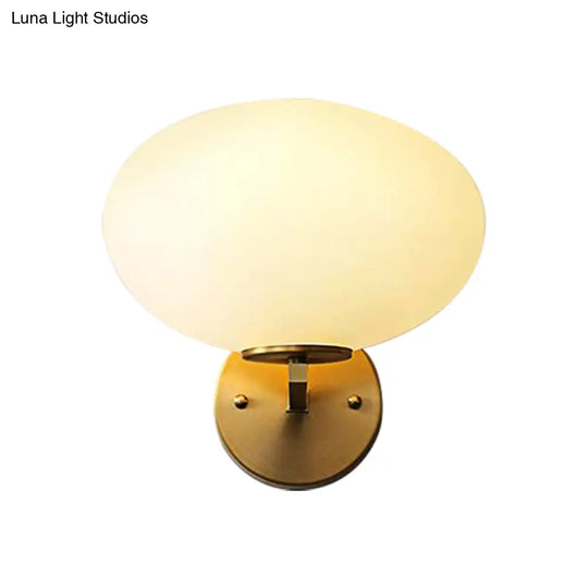 Modern Milk Glass Wall Sconce With Brass Finish