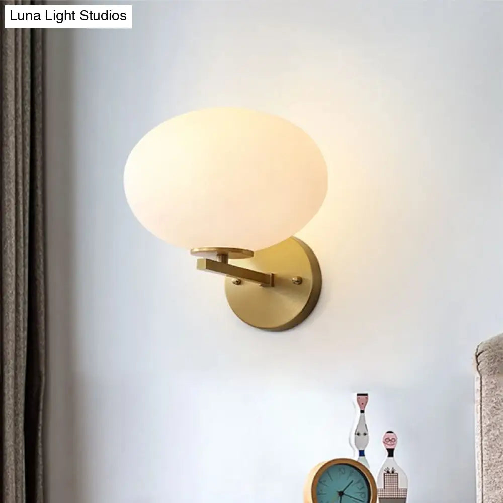 Modern Milk Glass Wall Sconce With Brass Finish