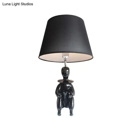 Modern Resin Sitting People Desk Lamp With Tapered Shade - 1 Bulb Light For Kitchen