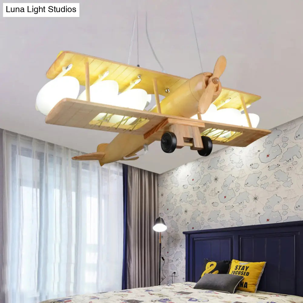 Nordic Beige Wood Pendant Light: Glider Shaped Hanging Light For Kindergarten