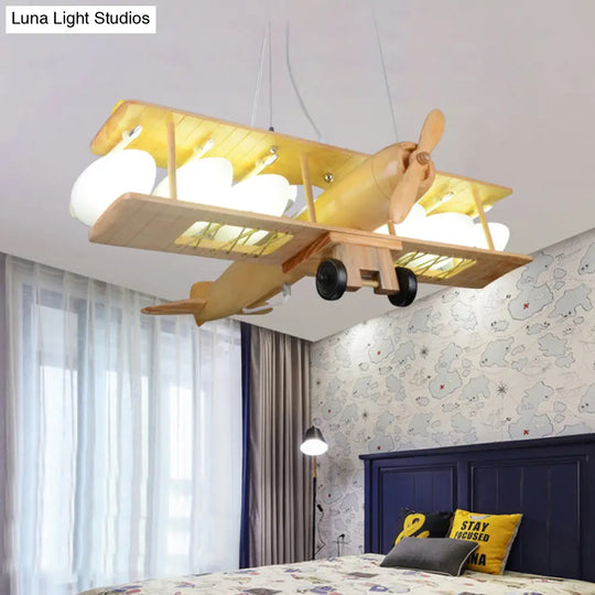 Nordic Beige Wood Pendant Light: Glider Shaped Hanging Light For Kindergarten