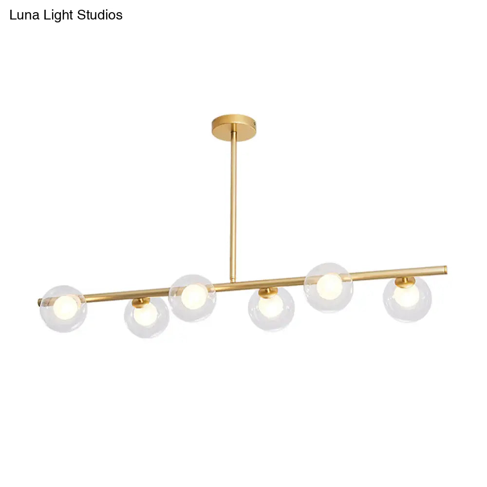 Nordic Metal 6-Head Linear Island Light With Gold Finish And Clear Glass Globes