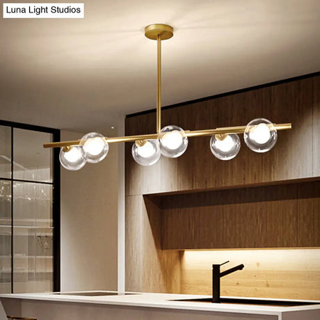 Nordic Metal 6-Head Linear Island Light With Gold Finish And Clear Glass Globes
