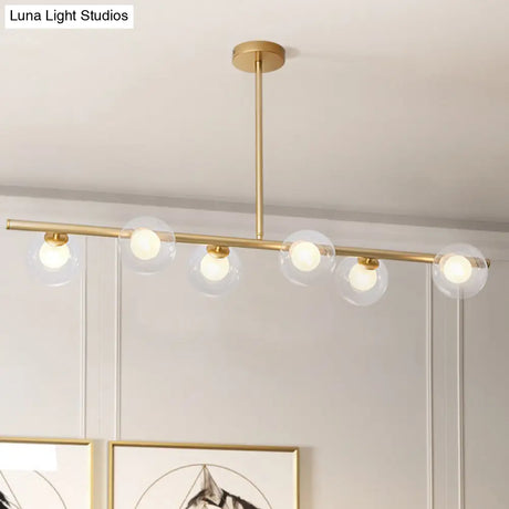Nordic Metal 6-Head Linear Island Light With Gold Finish And Clear Glass Globes