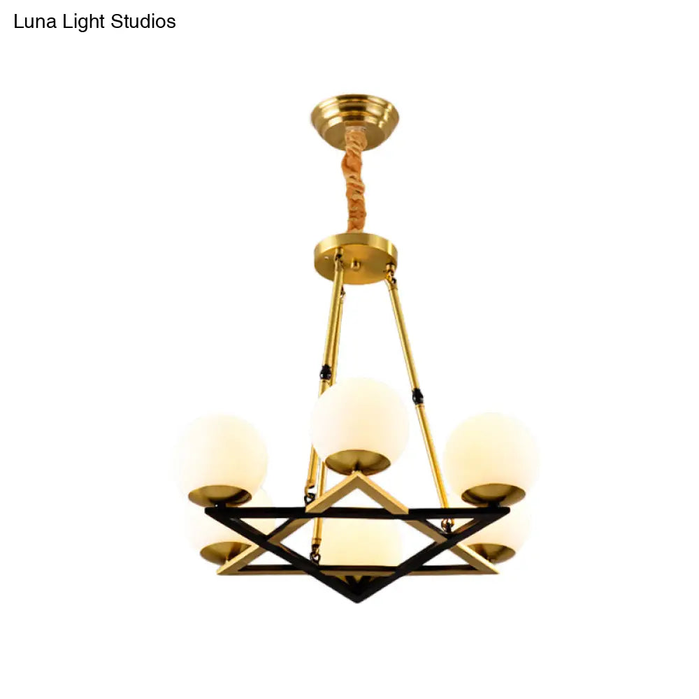 Postmodern Polygon Metal Chandelier With Brass Finish And Globe White Glass Shades