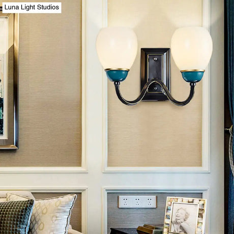 Rustic Globe Half-Wall Light With Blue Opal Glass And Curved Arm