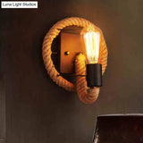 Rustic Indoor Wall Light With Wagon Wheel Design And Rope Shade