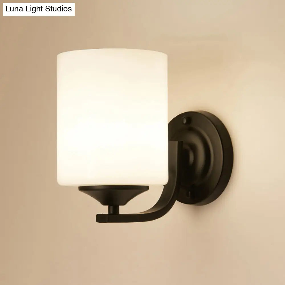Sleek Black Wall Sconce With White Glass Cylinder - Single-Bulb Simplicity Fixture