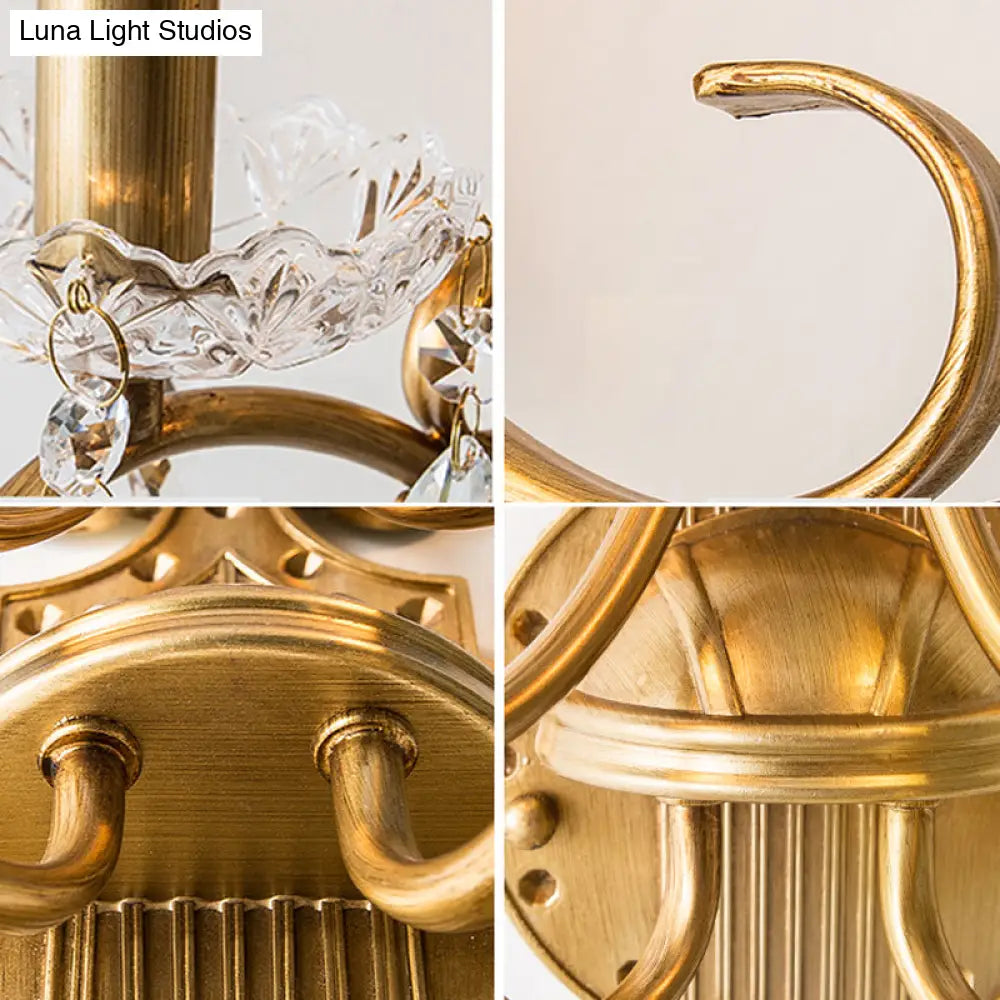 Traditional Crystal Candle Wall Sconce With Antiqued Brass Finish And Scroll Arm
