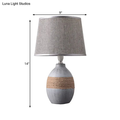 Traditional Flaxen/Grey Nightstand Lamp With Ceramic Base - 1-Light Fabric Drum Desk Light