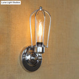 Vintage-Style Mini Wall Sconce With Cage Shade And Rustic Brass Finish For Living Room